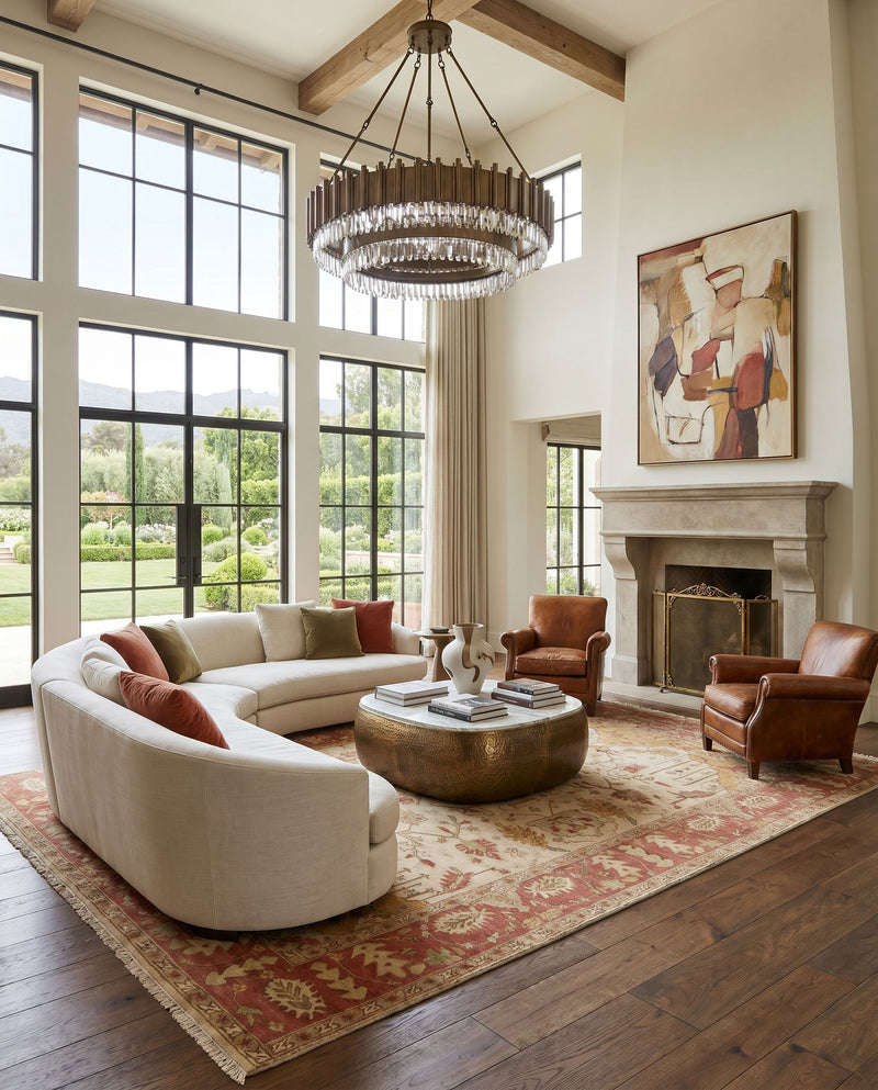 Adana IT-1181 Hand Knotted Rug as the centerpiece of a bright luxury living room — a hand knotted traditional area rug in mustard, burgundy, brown and medium brown tones