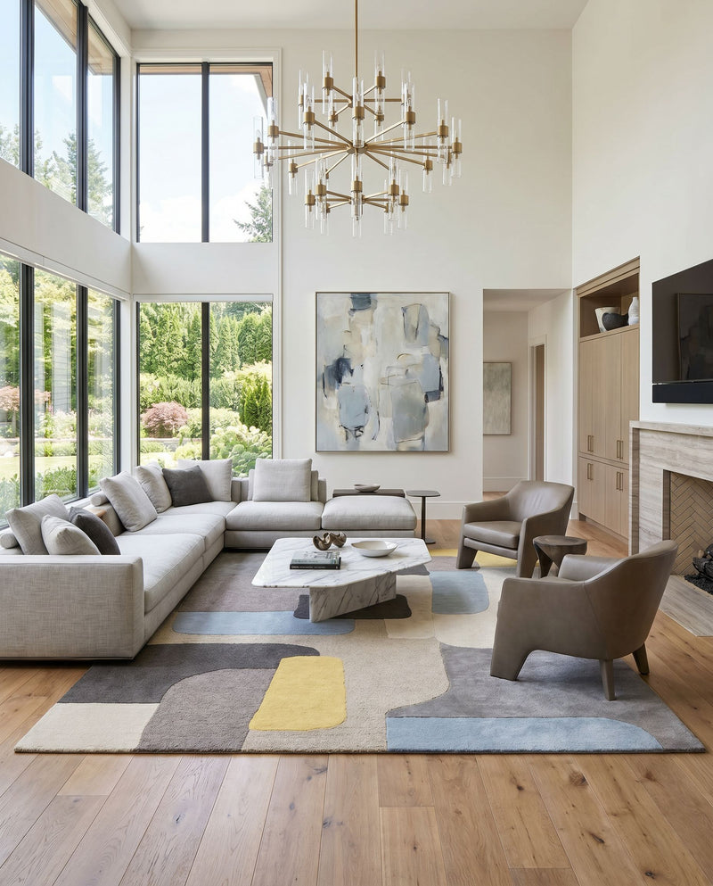 Brooklyn BRO-2300 Hand Tufted Rug as the centerpiece of a bright luxury living room — a hand tufted modern area rug in yellow, beige, charcoal and pale blue tones