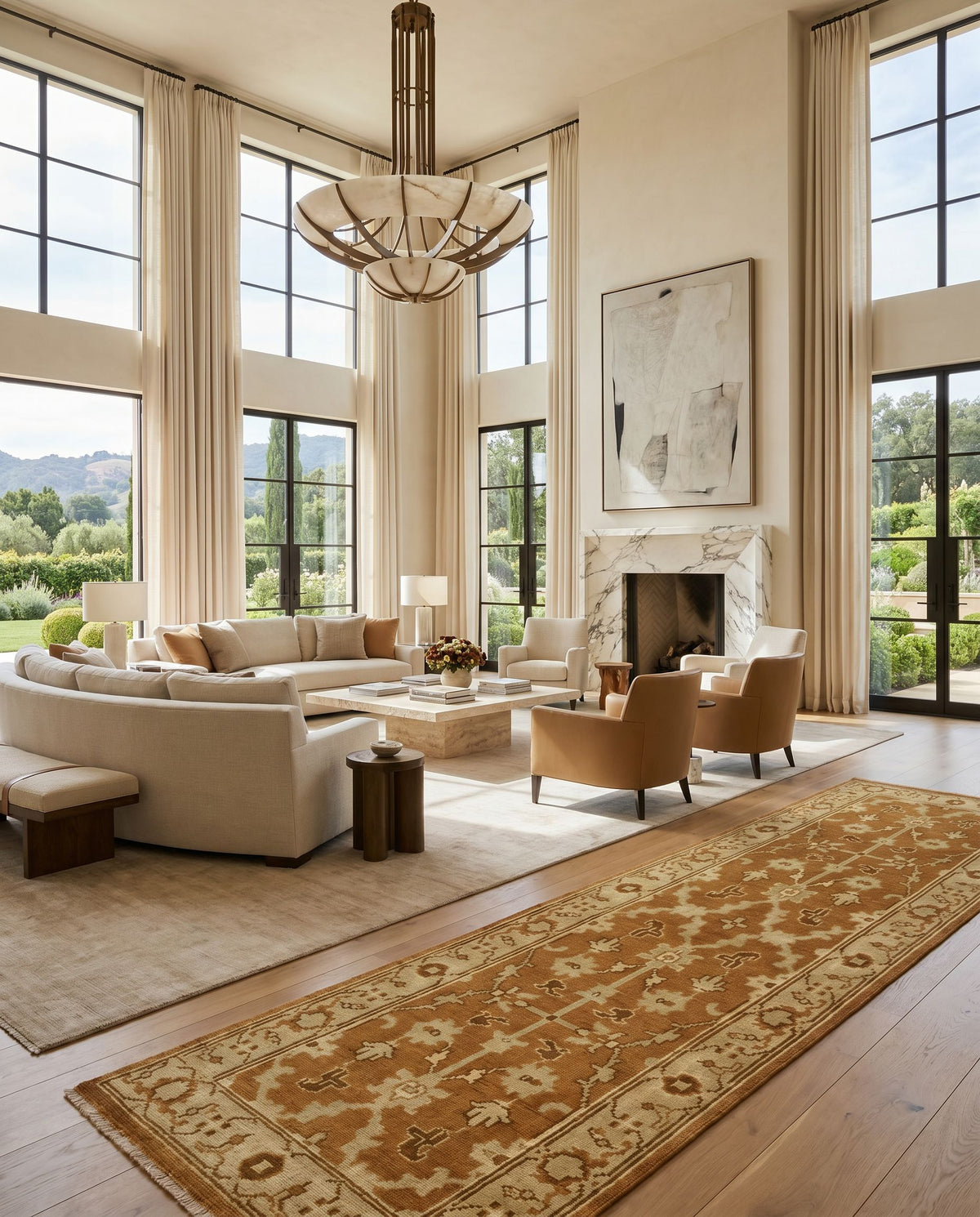 Ainsley AIN-1002 Hand Knotted Rug as the centerpiece of a bright luxury living room — a hand knotted traditional area rug in faded driftwood, dark brown, off white and straw tones