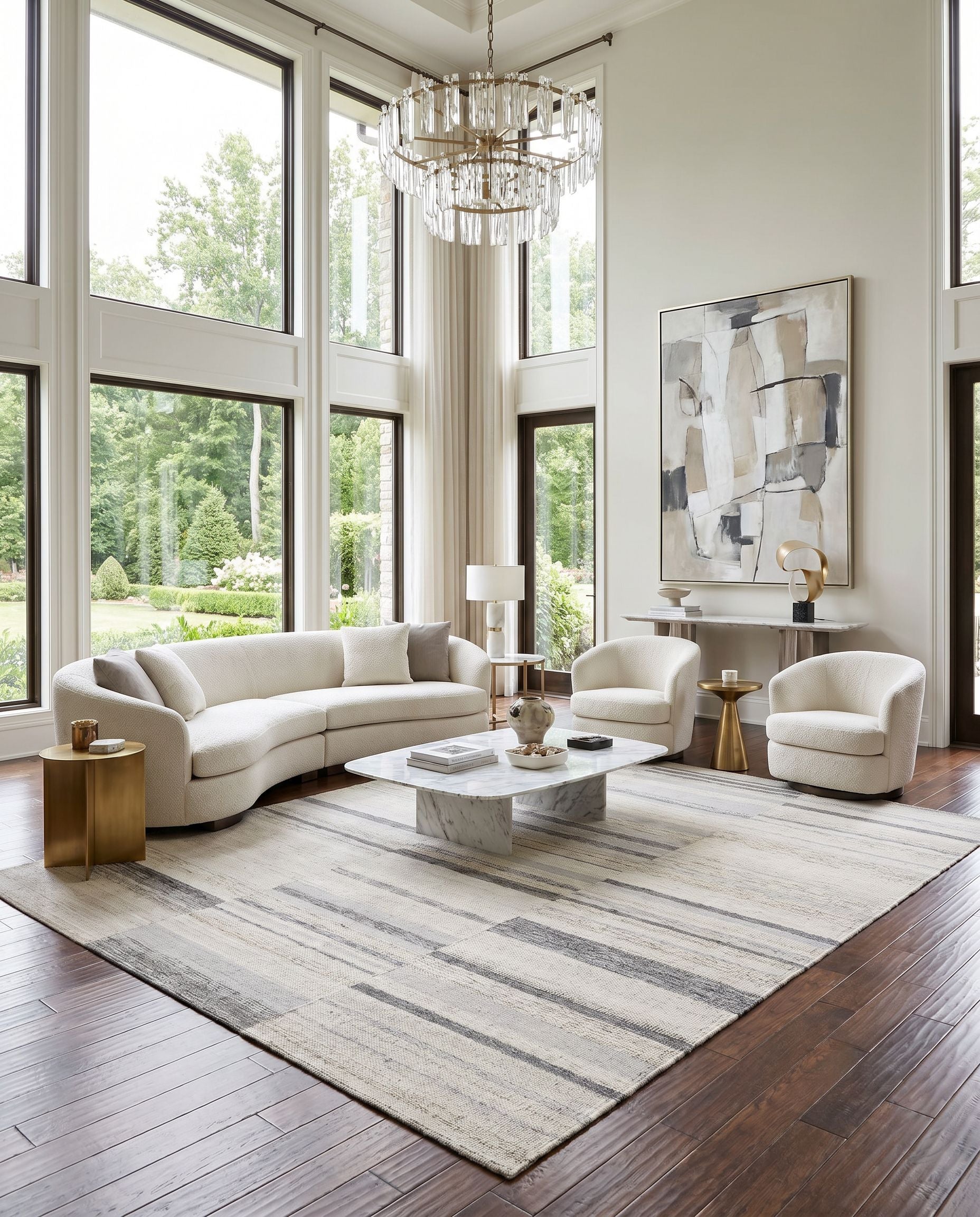 Scandi SCD-2305 Hand Woven Rug as the centerpiece of a bright luxury living room — a hand woven global area rug in black, medium gray, light gray and tan tones