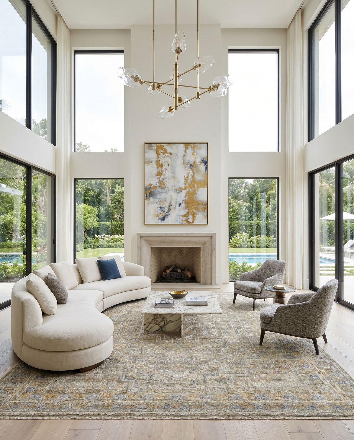 Nobility NBI-2314 Hand Knotted Rug as the centerpiece of a bright luxury living room — a hand knotted traditional area rug in tan, charcoal, wheat and light gray tones