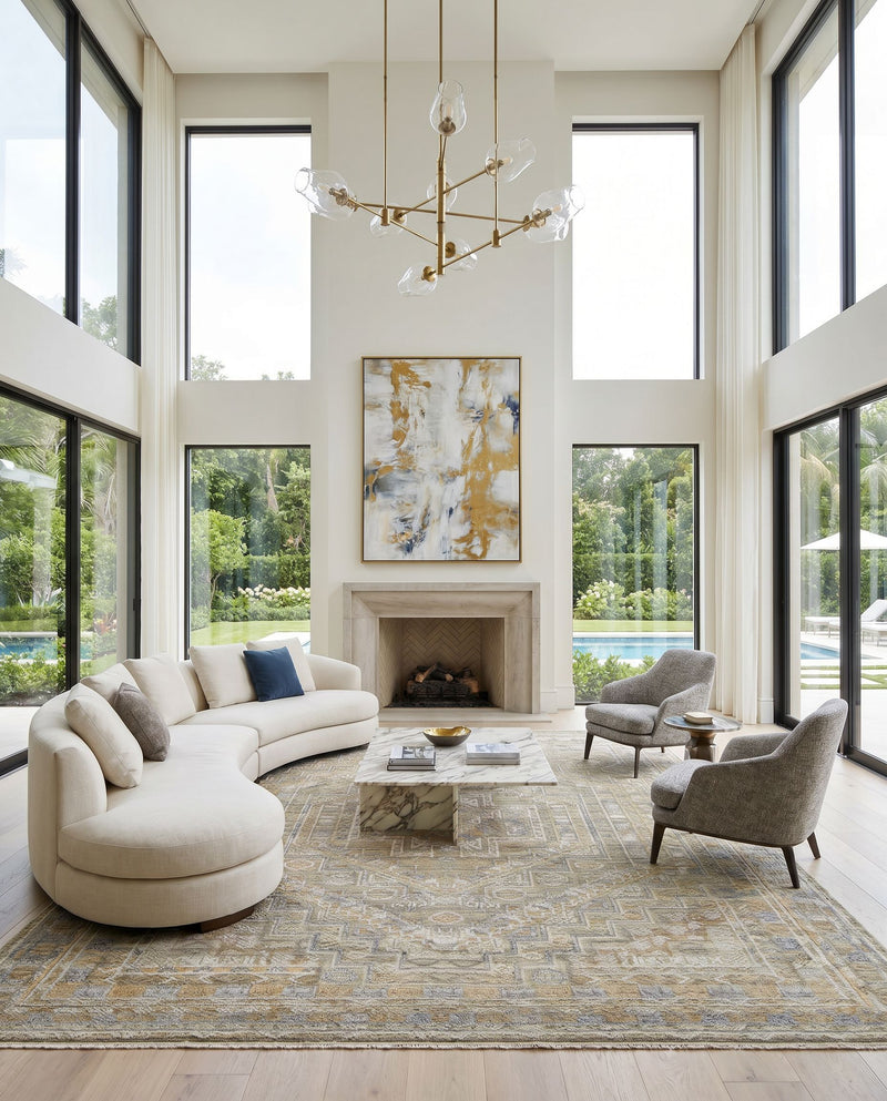 Nobility NBI-2314 Hand Knotted Rug as the centerpiece of a bright luxury living room — a hand knotted traditional area rug in tan, charcoal, wheat and light gray tones