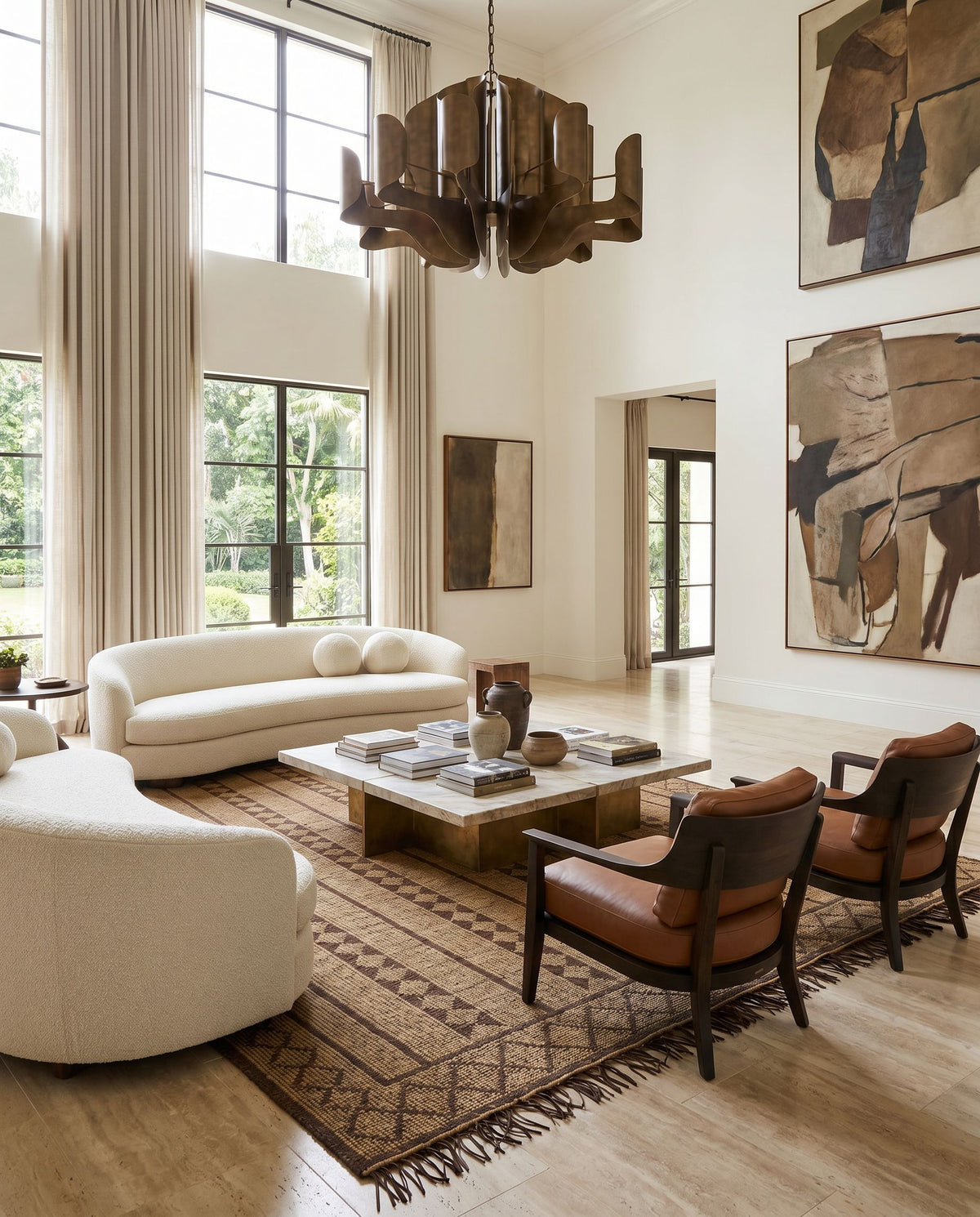 Touareg TOG-2300 Hand Woven Rug as the centerpiece of a bright luxury living room — a hand woven global area rug in tan, dark brown and charcoal tones