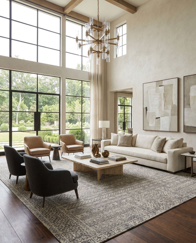 Oakland OAA-1009 Hand Tufted Rug as the centerpiece of a bright luxury living room — a hand tufted global area rug in black, gray and taupe tones