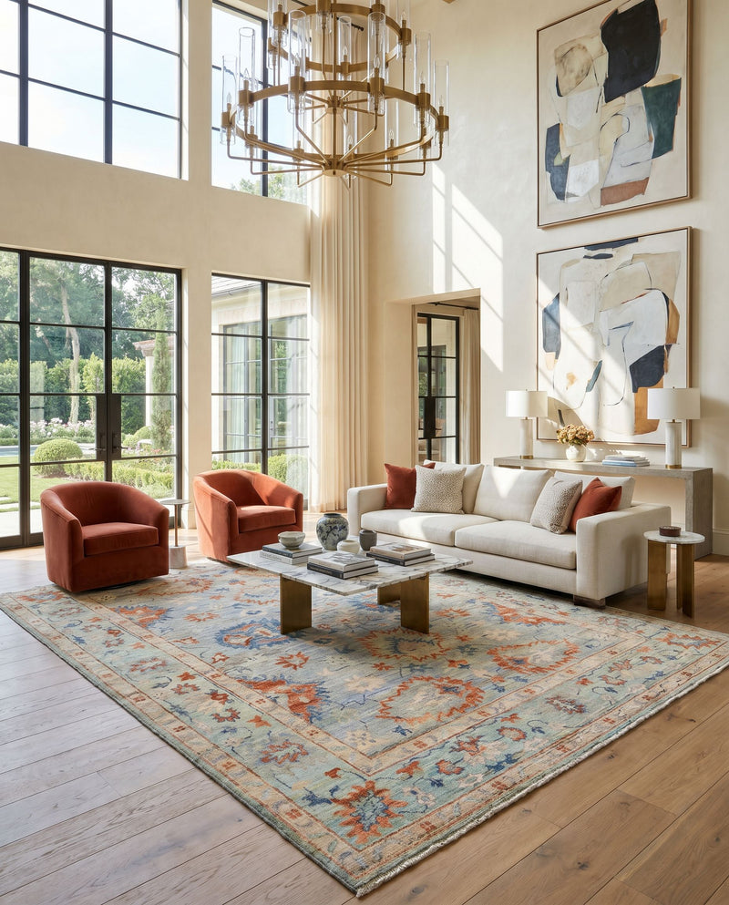 Ghazni GHZ-2305 Hand Knotted Rug as the centerpiece of a bright luxury living room — a hand knotted traditional area rug in denim, beige, light brown and dark blue tones
