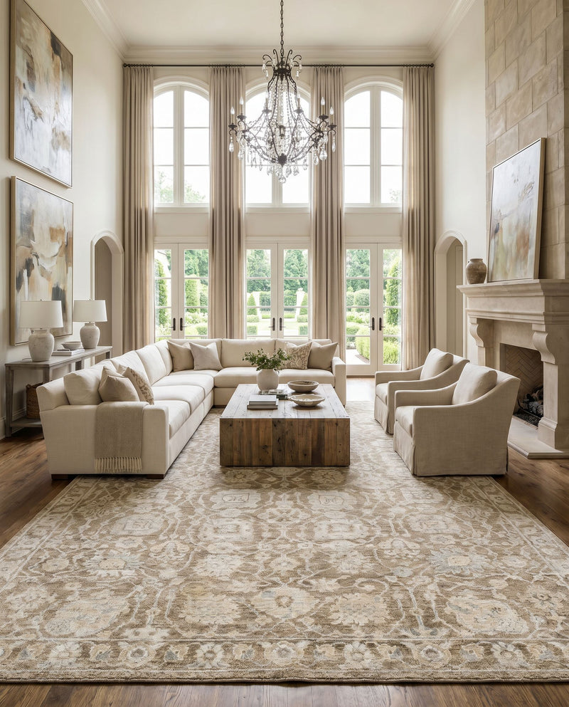 Royal RYL-2303 Hand Knotted Rug as the centerpiece of a bright luxury living room — a hand knotted traditional area rug in taupe, light beige, gray and slate tones