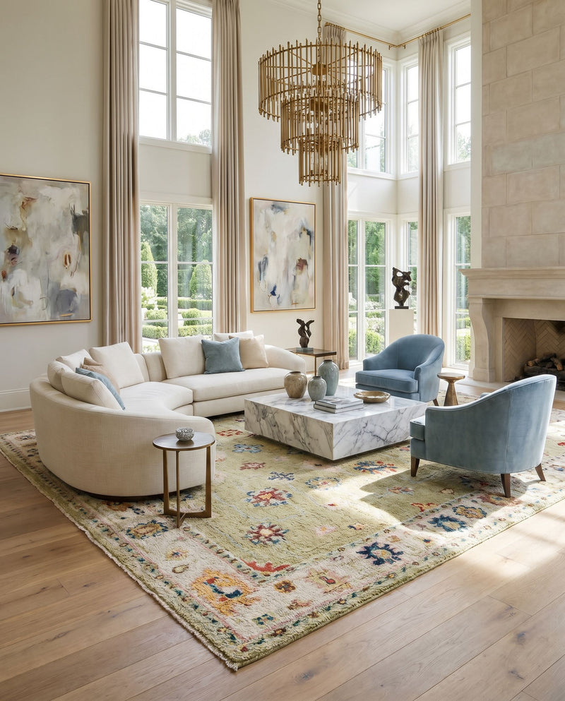 Marrakech MRK-2307 Hand Knotted Rug as the centerpiece of a bright luxury living room — a hand knotted traditional area rug in light sage, dark blue, pale blue and light pink tones