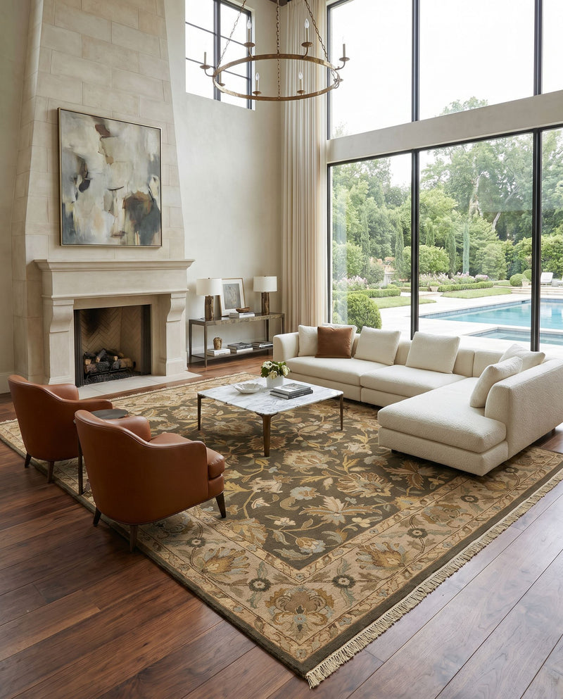 Soumek SMK-74 Hand Knotted Rug as the centerpiece of a bright luxury living room — a hand knotted traditional area rug in tan, beige, olive and dark brown tones