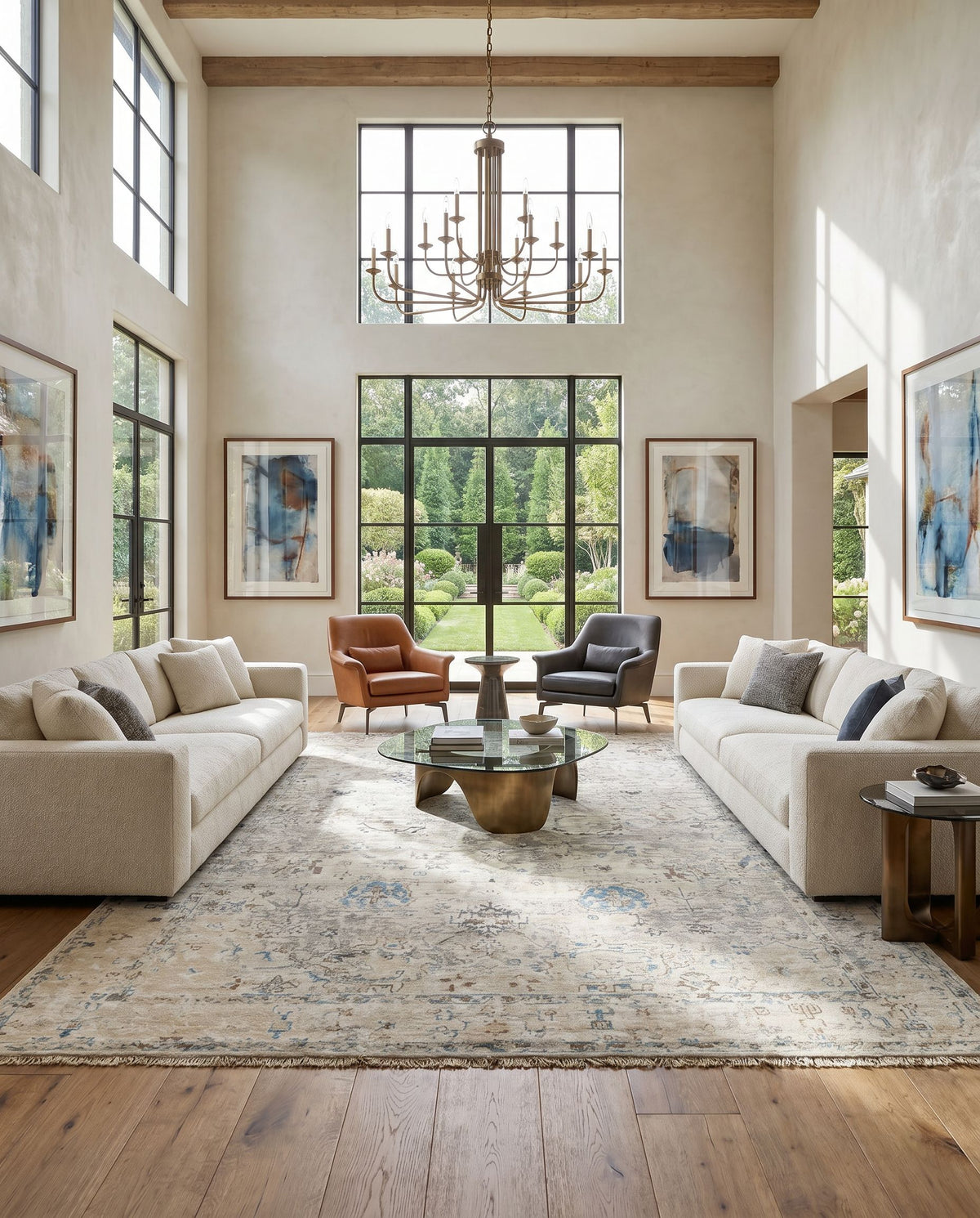 Theodora THO-3008 Hand Knotted Rug as the centerpiece of a bright luxury living room — a hand knotted traditional area rug in denim, sky blue, brown and charcoal tones