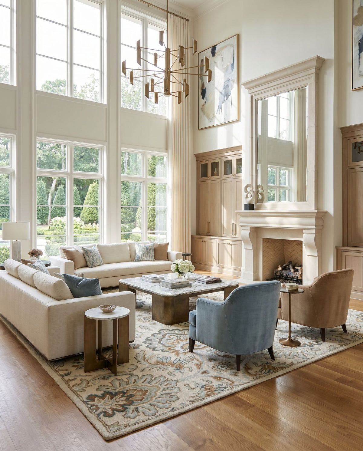 Caesar CAE-1228 Hand Tufted Rug as the centerpiece of a bright luxury living room — a hand tufted traditional area rug in ivory, taupe, sage and sky blue tones