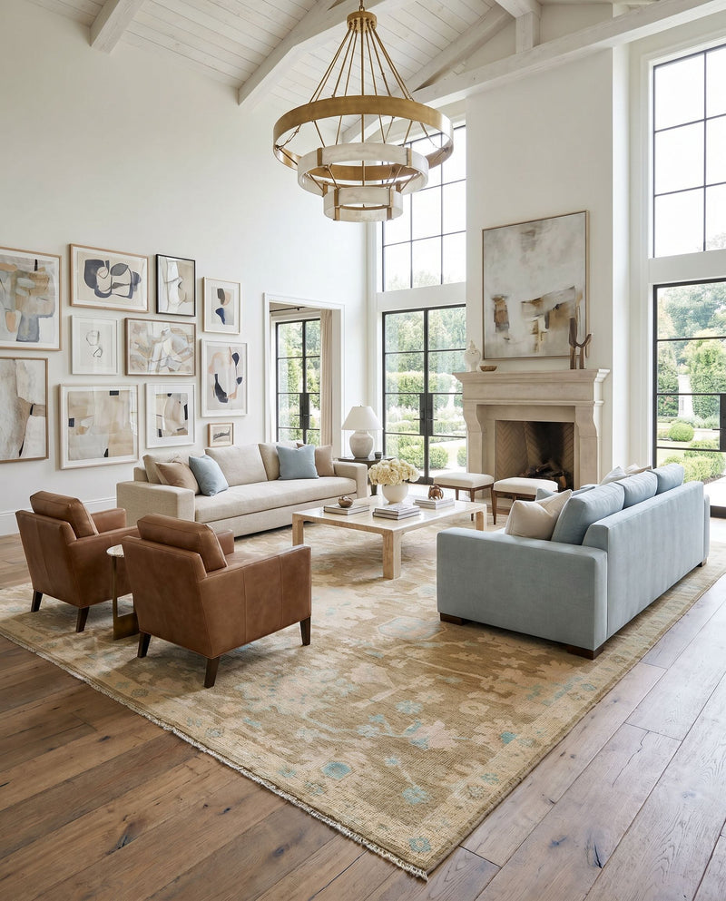 Antalya AAT-2309 Hand Knotted Rug as the centerpiece of a bright luxury living room — a hand knotted traditional area rug in denim, dark brown, taupe and blue tones