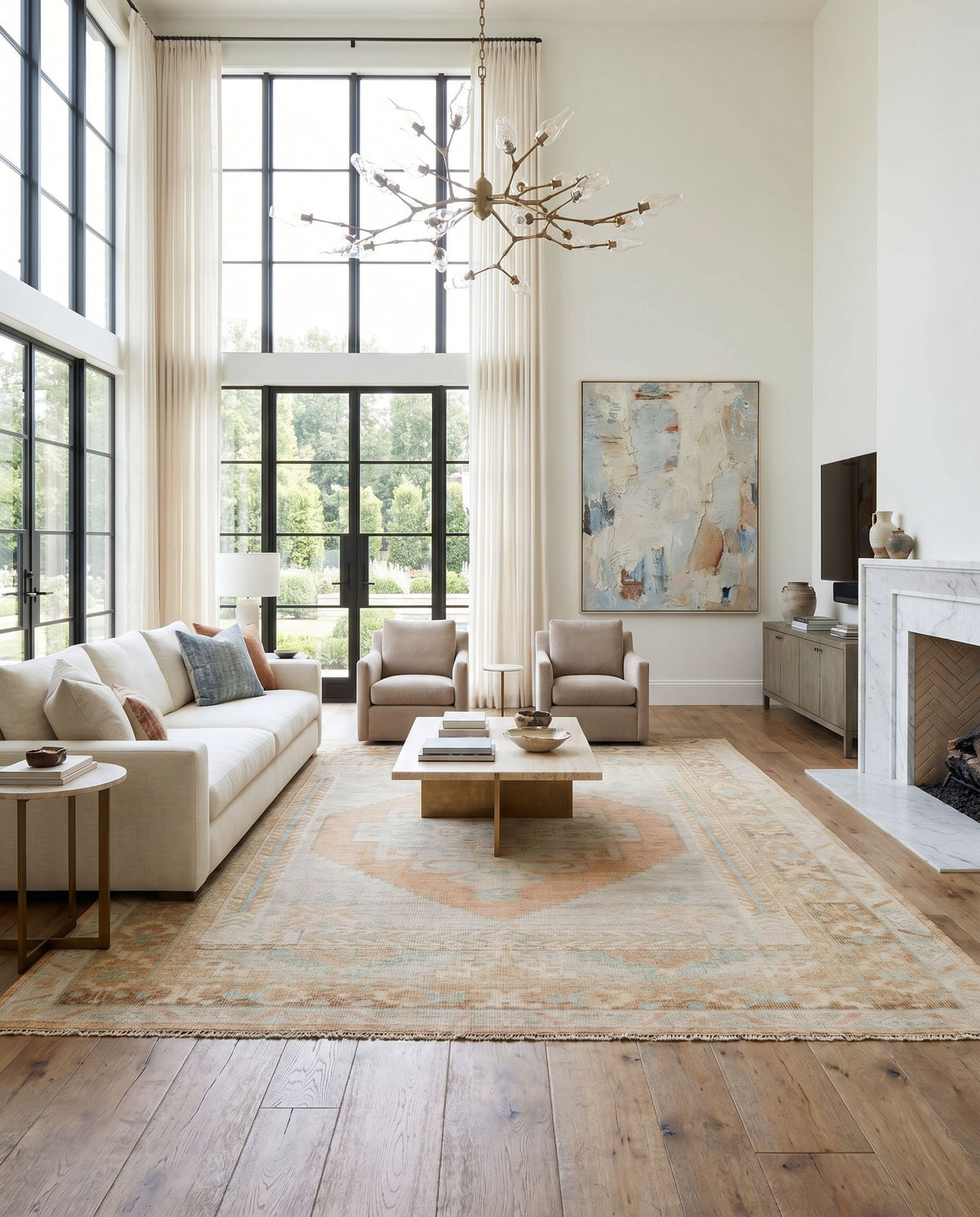 Anadolu AAU-2306 Hand Knotted Rug as the centerpiece of a bright luxury living room — a hand knotted traditional area rug in seafoam, beige, pale blue and light blue tones