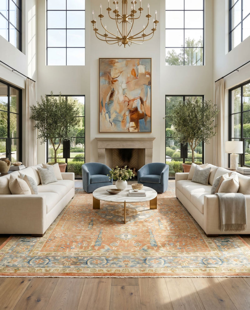 Hamadan HAM-2306 Hand Knotted Rug as the centerpiece of a bright luxury living room — a hand knotted traditional area rug in burnt orange, medium gray, ivory and mustard tones