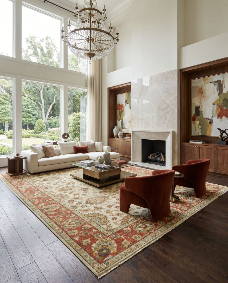 Pazyryk PZY-1002 Hand Knotted Rug as the centerpiece of a bright luxury living room — a hand knotted traditional area rug in light olive, rust, pale blue and tan tones