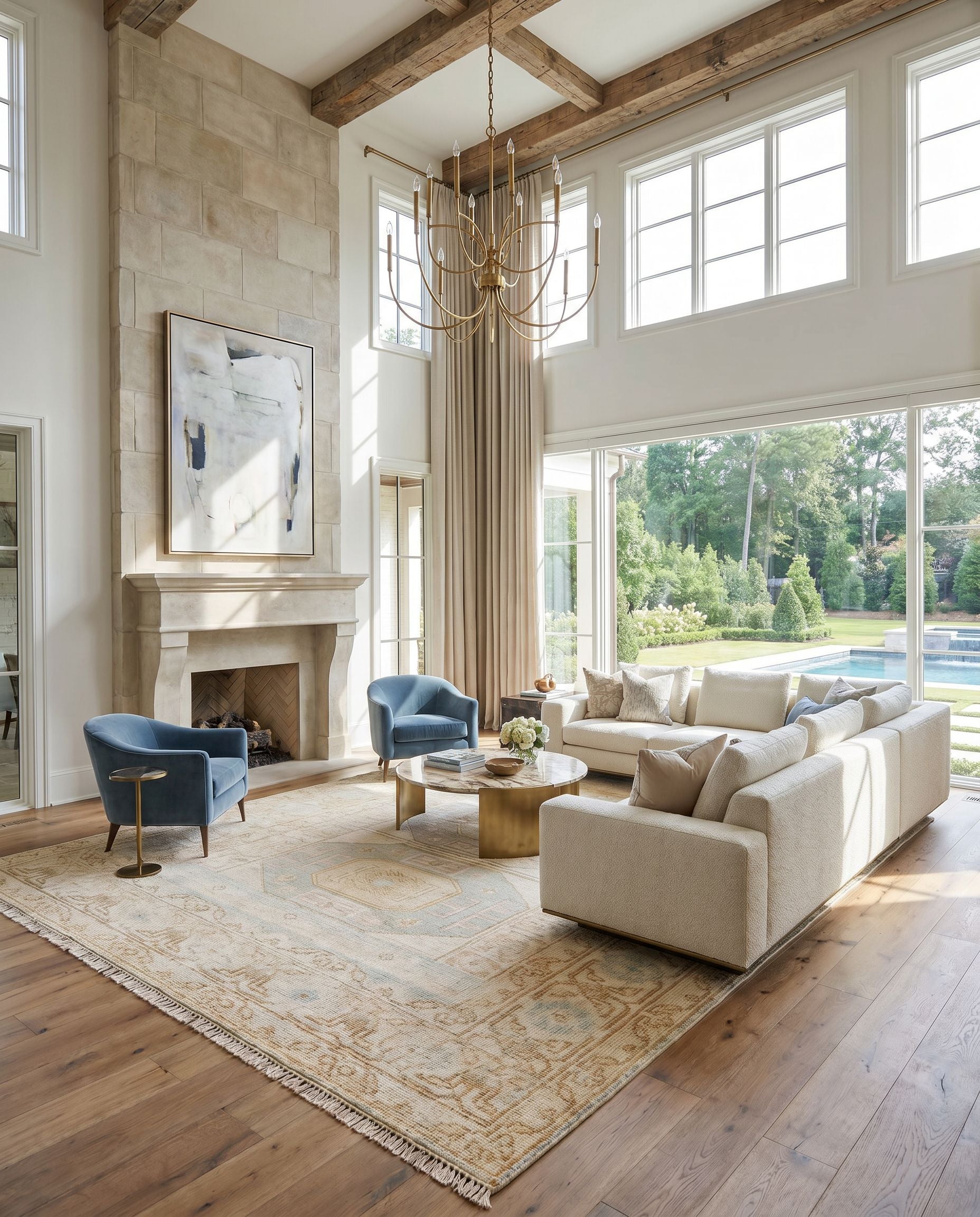 Anadolu AAU-2304 Hand Knotted Rug as the centerpiece of a bright luxury living room — a hand knotted traditional area rug in ice blue, dusty pink, light beige and mustard tones