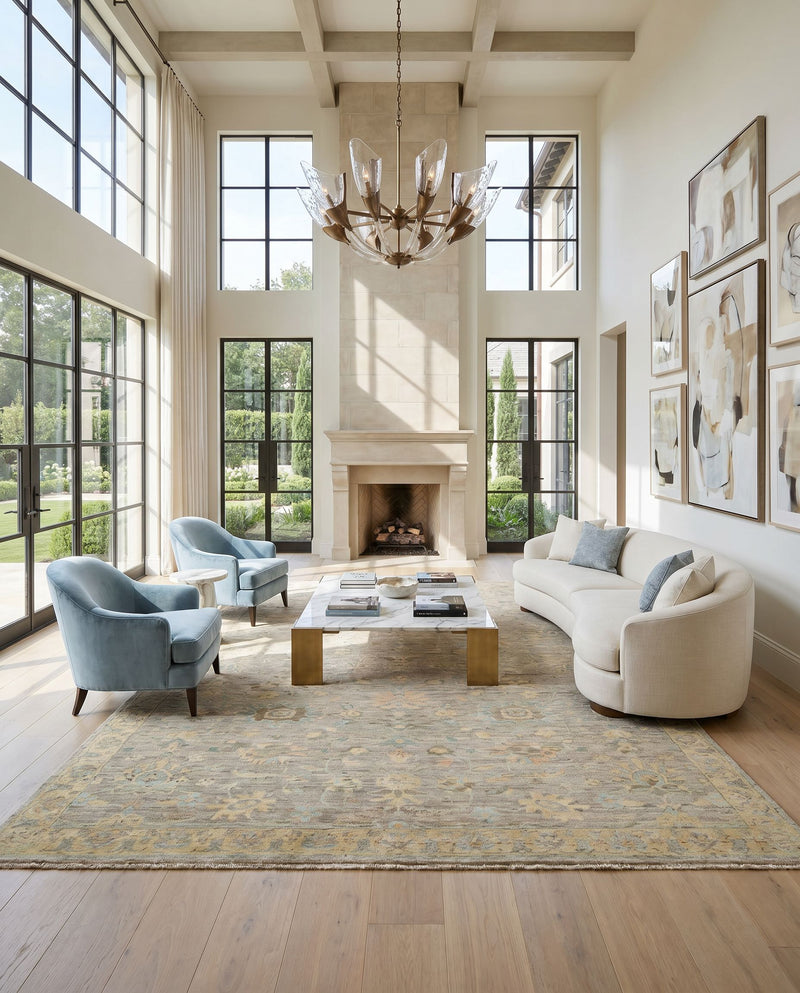 Ghazni GHZ-2301 Hand Knotted Rug as the centerpiece of a bright luxury living room — a hand knotted traditional area rug in ice blue, medium gray, gray and tan tones