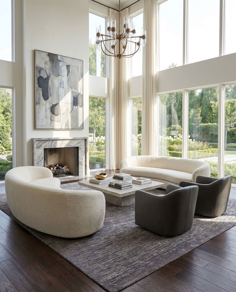 Capri CAP-2307 Hand Knotted Rug as the centerpiece of a bright luxury living room — a hand knotted modern area rug in black and charcoal tones