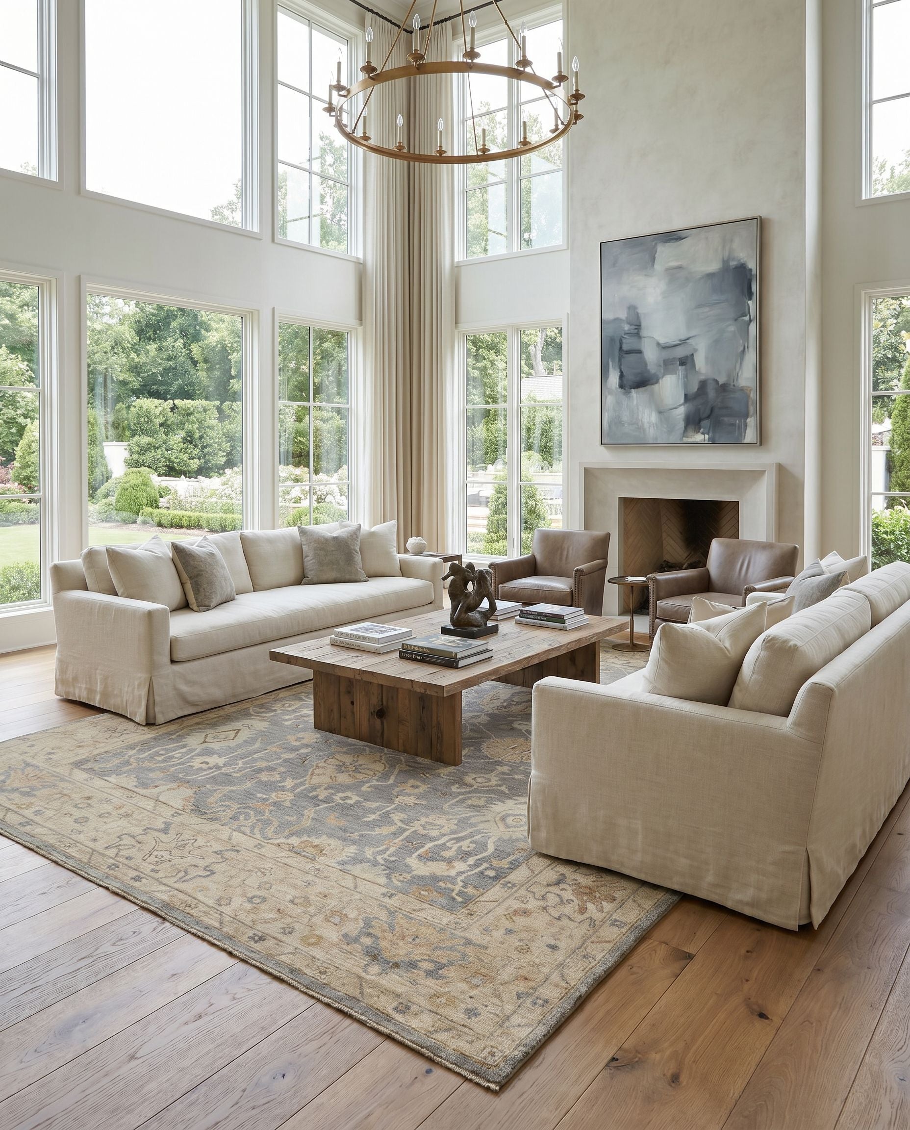 Normandy NOY-8007 Hand Knotted Rug as the centerpiece of a bright luxury living room — a hand knotted traditional area rug in charcoal, medium gray, beige and light blue tones