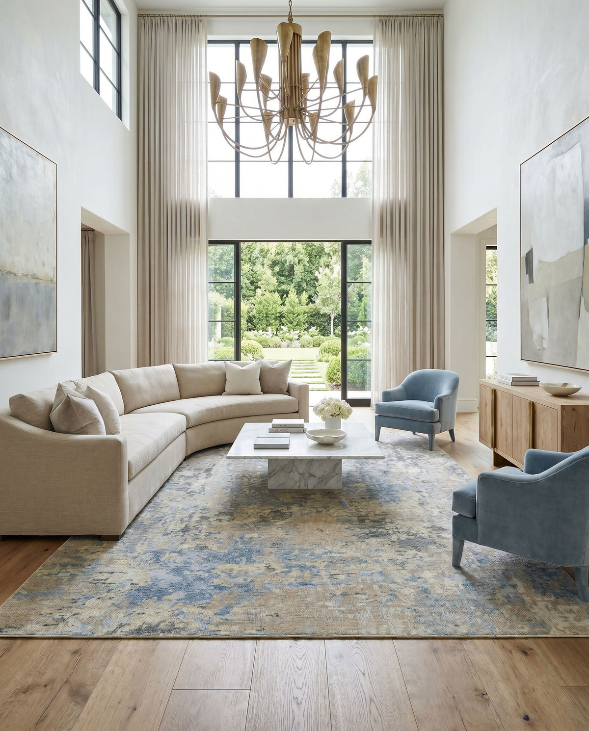 Odyssey ODY-2301 Hand Knotted Rug as the centerpiece of a bright luxury living room — a hand knotted modern area rug in tan, beige, denim and dark blue tones