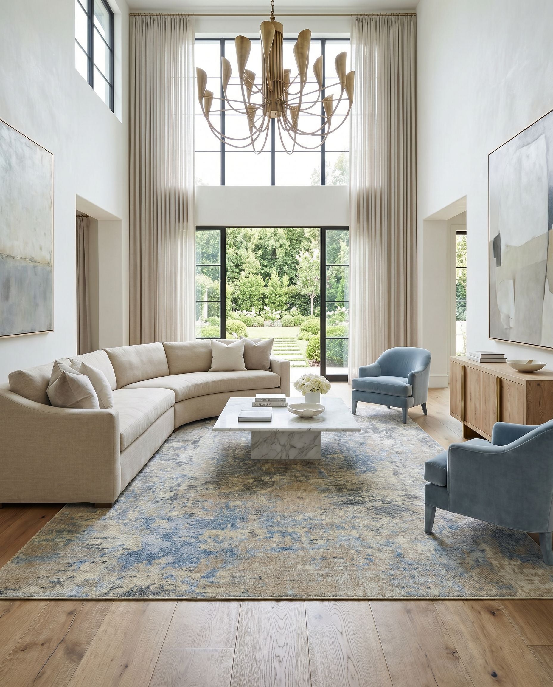 Odyssey ODY-2301 Hand Knotted Rug as the centerpiece of a bright luxury living room — a hand knotted modern area rug in tan, beige, denim and dark blue tones
