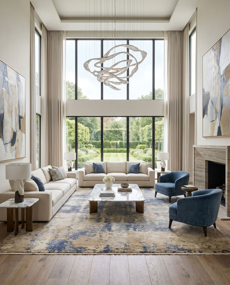 Emery EYM-2300 Hand Knotted Rug as the centerpiece of a bright luxury living room — a hand knotted modern area rug in gray, oatmeal, charcoal and beige tones