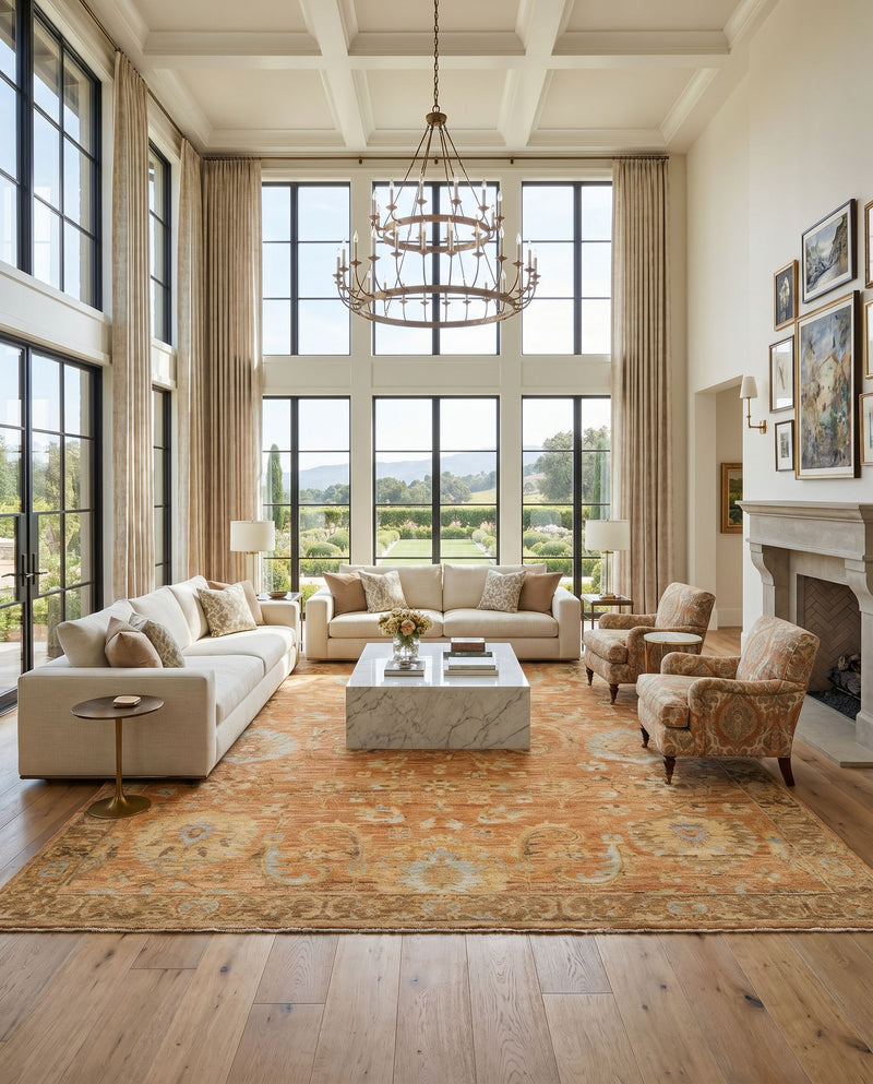 Ghazni GHZ-2300 Hand Knotted Rug as the centerpiece of a bright luxury living room — a hand knotted traditional area rug in burnt orange, light brown, mauve and tan tones