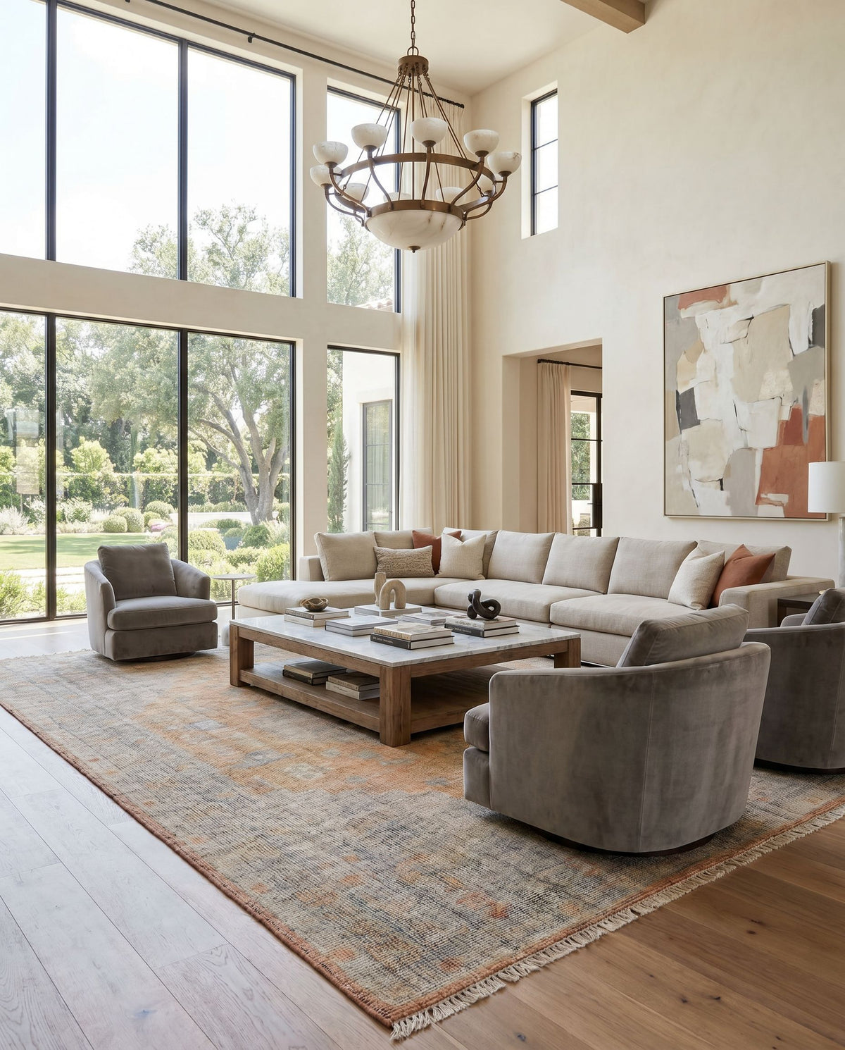 Nirvana NVN-2301 Hand Knotted Rug as the centerpiece of a bright luxury living room — a hand knotted traditional area rug in dusty coral, mustard, beige and medium gray tones