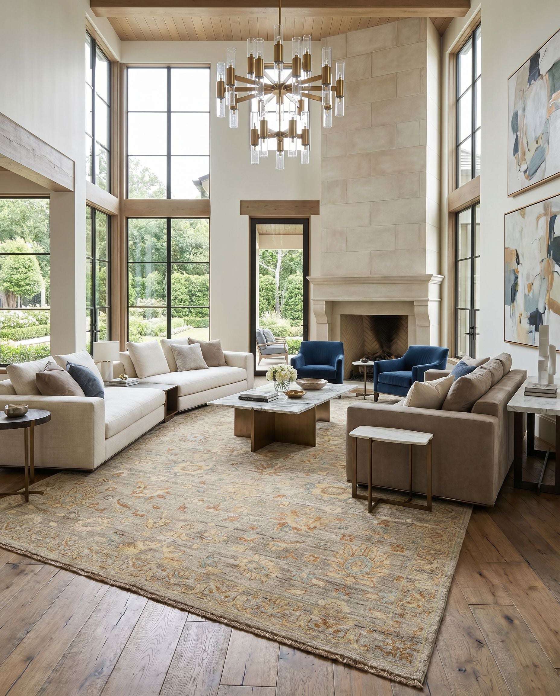 Ghazni GHZ-2302 Hand Knotted Rug as the centerpiece of a bright luxury living room — a hand knotted traditional area rug in tan, dark blue, light blue and gray tones