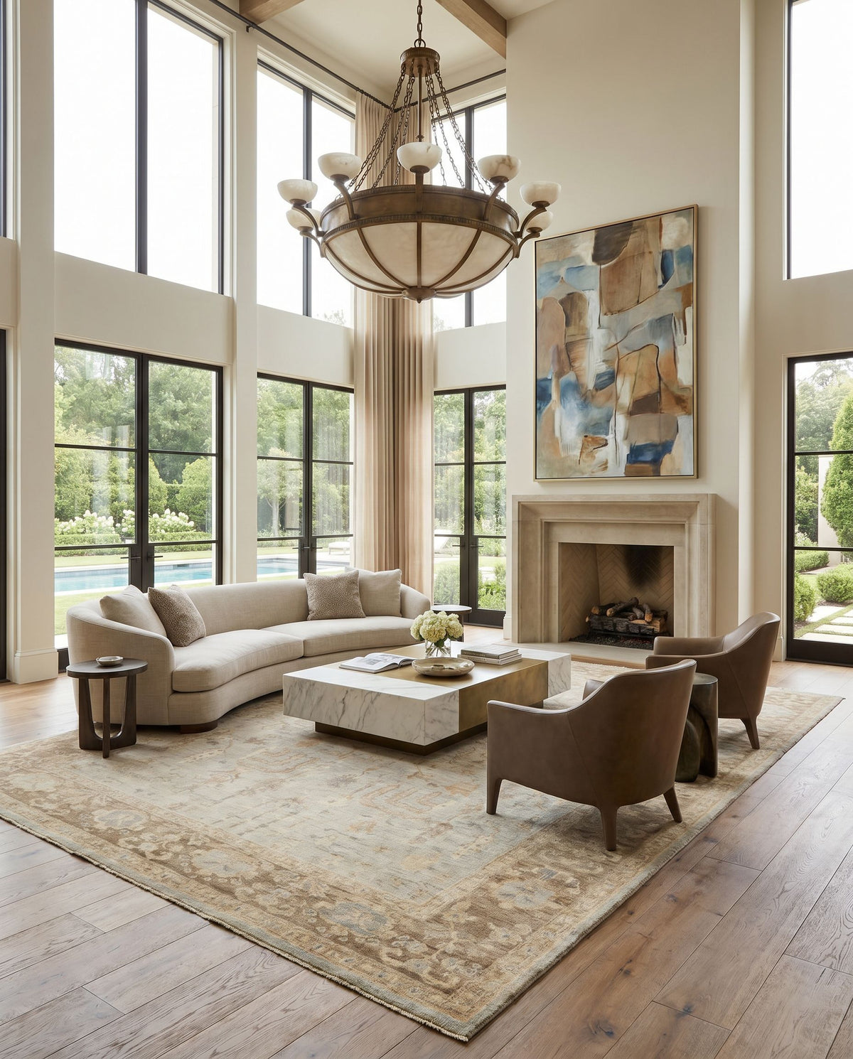 Normandy NOY-8003 Hand Knotted Rug as the centerpiece of a bright luxury living room — a hand knotted traditional area rug in cream, light sage, tan and medium brown tones
