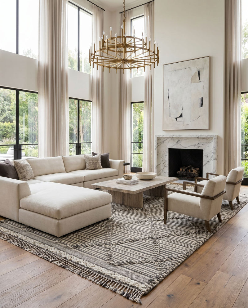 Cadiz CDZ-2300 Hand Knotted Rug as the centerpiece of a bright luxury living room — a hand knotted global area rug in ivory, black and gray tones