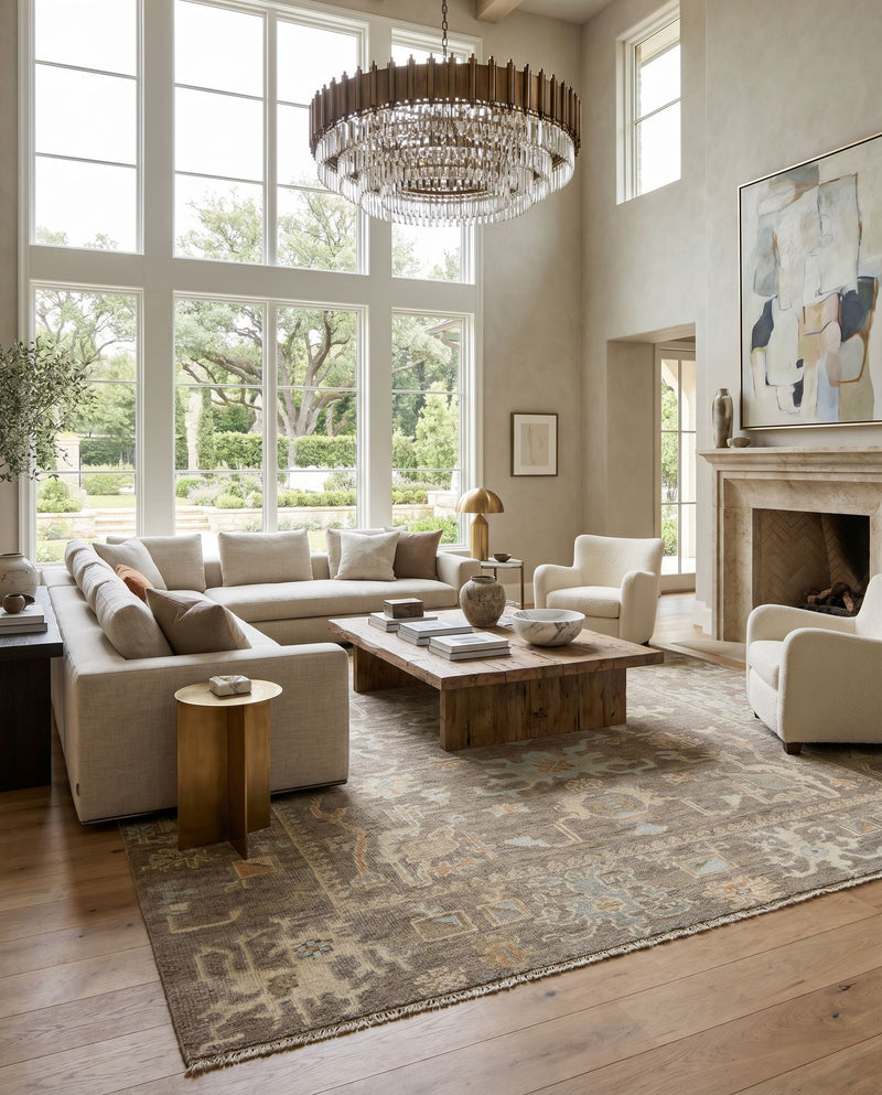 Antalya AAT-2303 Hand Knotted Rug as the centerpiece of a bright luxury living room — a hand knotted traditional area rug in dark brown, off-white, dusty sage and brown tones