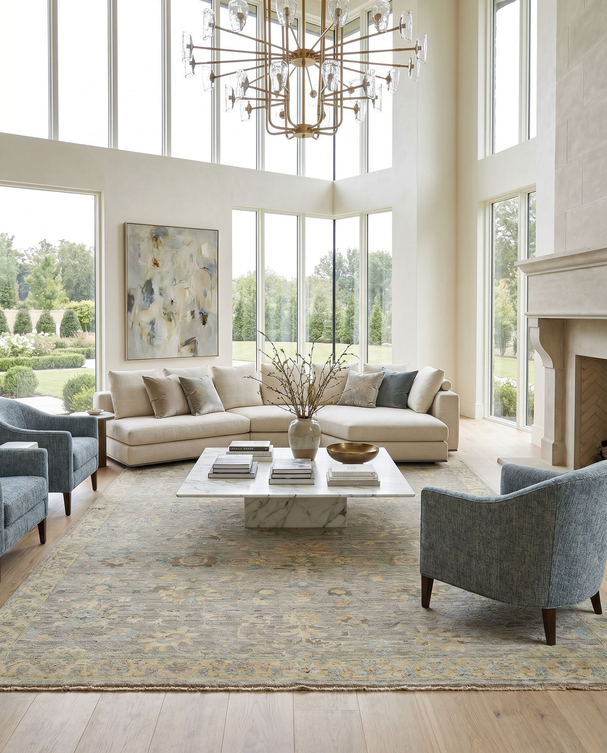 Ghazni GHZ-2301 Hand Knotted Rug styled in an elegant designer living room — hand knotted traditional area rug in ice blue, medium gray, gray and tan tones