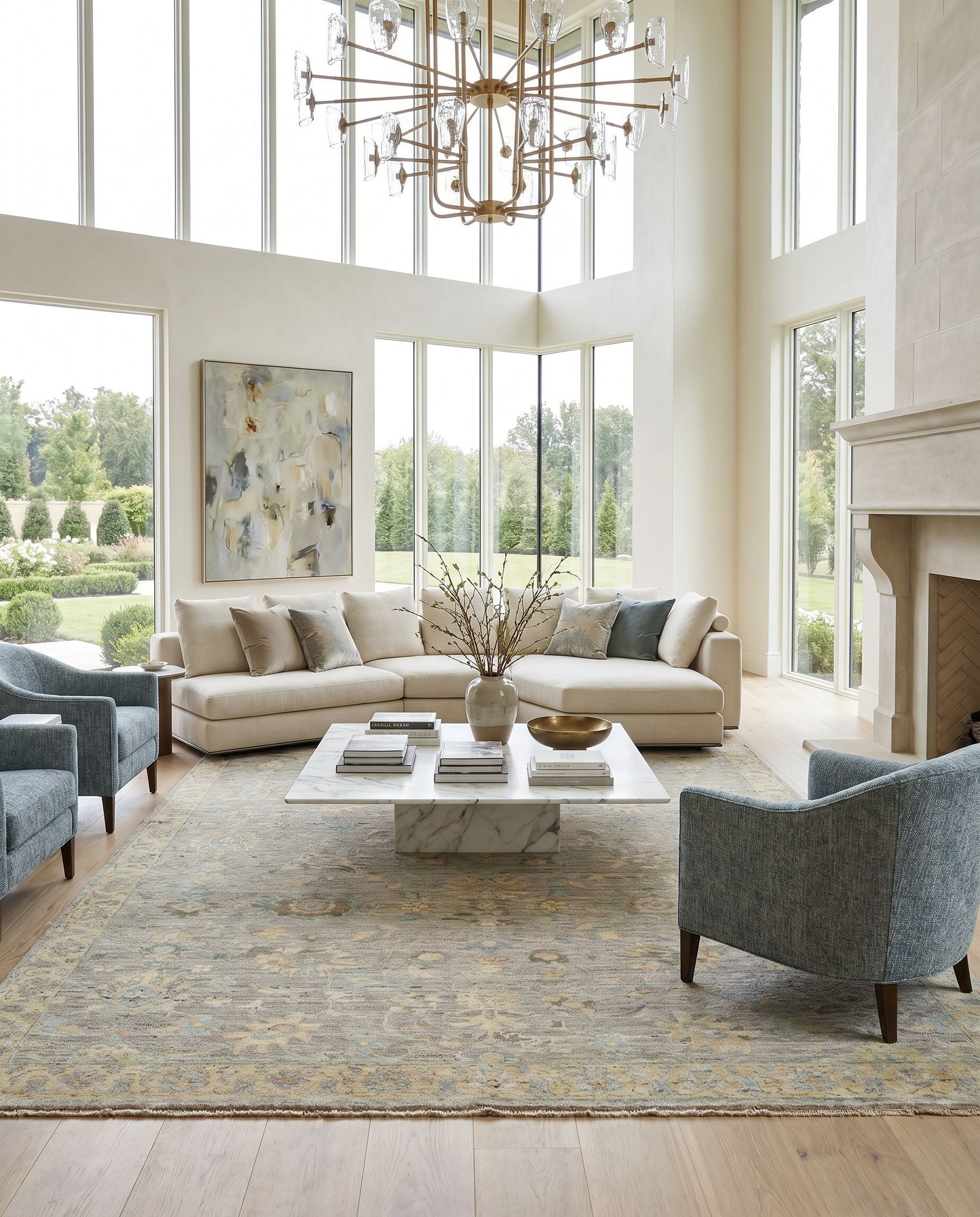 Ghazni GHZ-2301 Hand Knotted Rug styled in an elegant designer living room — hand knotted traditional area rug in ice blue, medium gray, gray and tan tones
