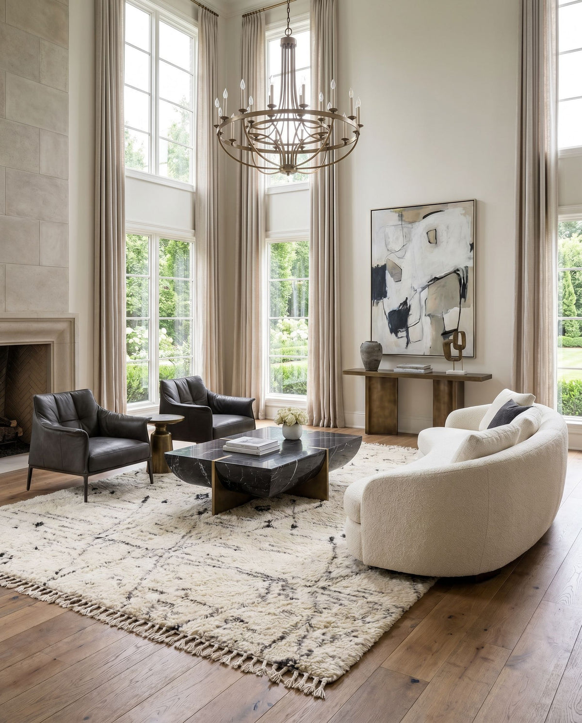 Camille CME-2304 Hand Knotted Rug styled in an elegant designer living room — hand knotted global area rug in cream, medium gray and black tones