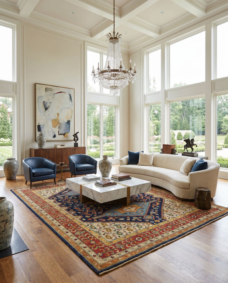 Reign REG-2300 Hand Knotted Rug styled in an elegant designer living room — hand knotted traditional area rug in navy, tan, beige and rust tones