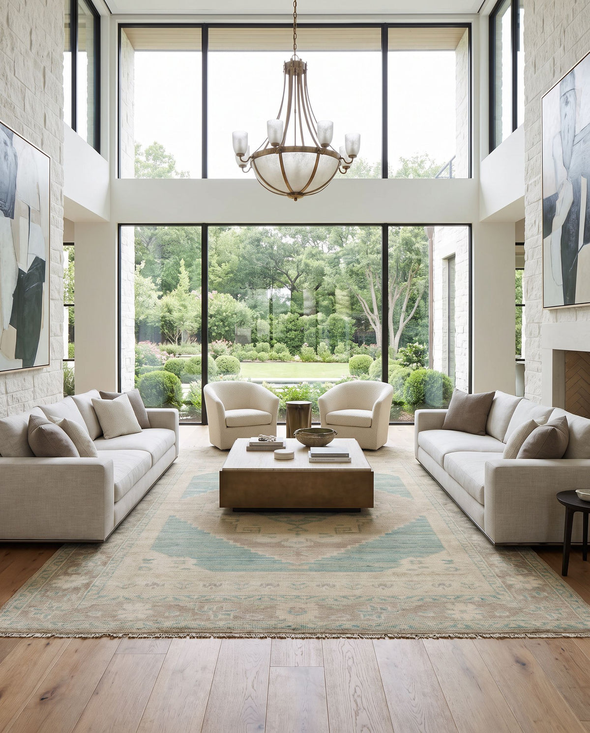 Anadolu AAU-2303 Hand Knotted Rug as the centerpiece of a bright luxury living room — a hand knotted traditional area rug in beige, seafoam, light sage and cream tones