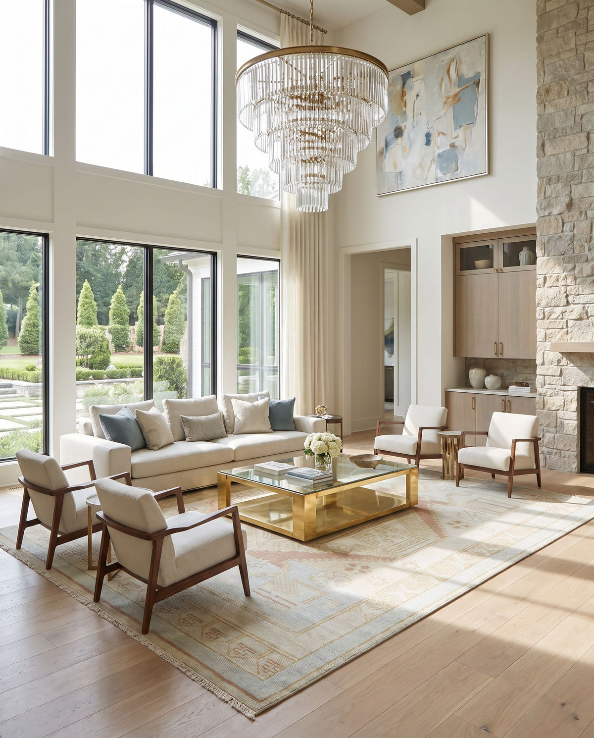Anadolu AAU-2307 Hand Knotted Rug styled in an elegant designer living room — hand knotted traditional area rug in blue, camel, cream and pale pink tones