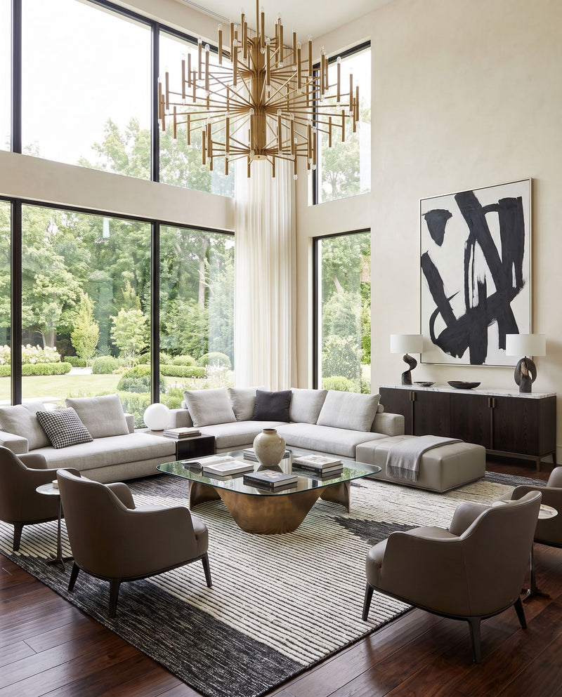 Apache APA-2311 Hand Woven Rug as the centerpiece of a bright luxury living room — a hand woven global area rug in black and cream tones