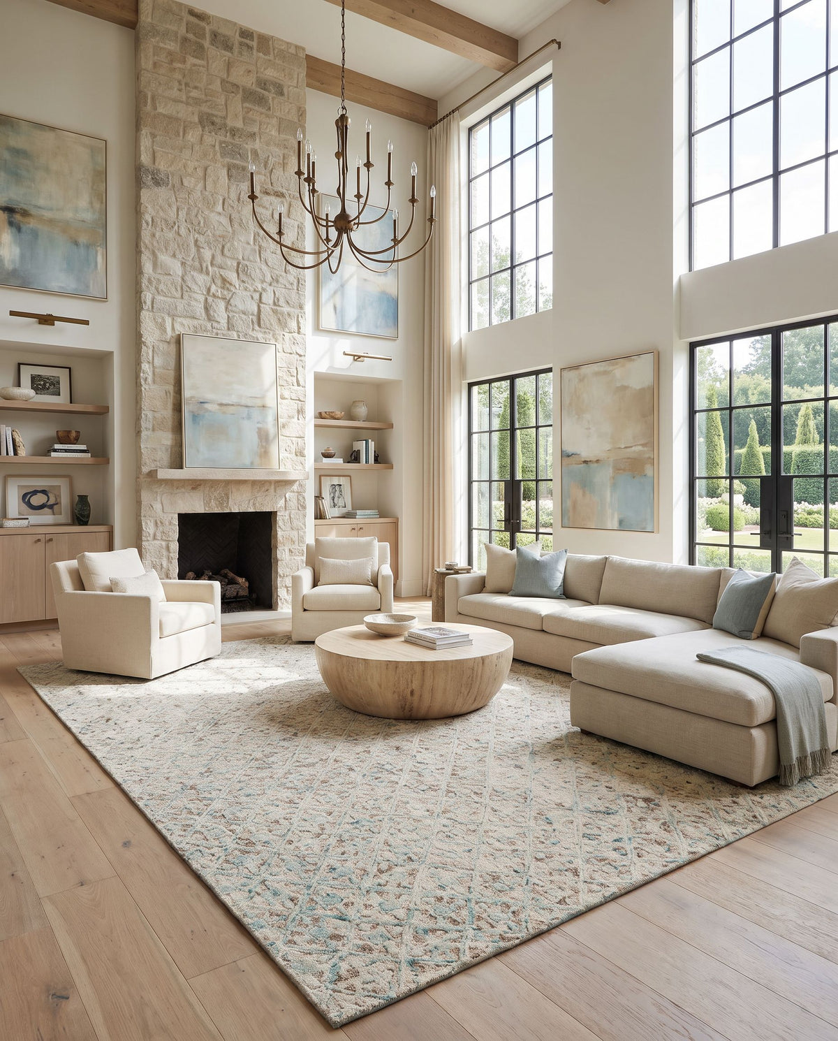 Avon AVO-2304 Hand Tufted Rug as the centerpiece of a bright luxury living room — a hand tufted traditional area rug in light sage, blue, beige and brown tones