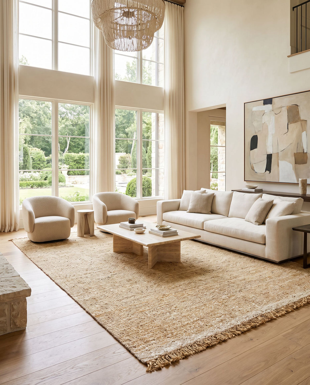 Aylin AYI-2303 Hand Woven Rug styled in an elegant designer living room — hand woven cottage area rug in black, taupe, tan and metallic gold tones