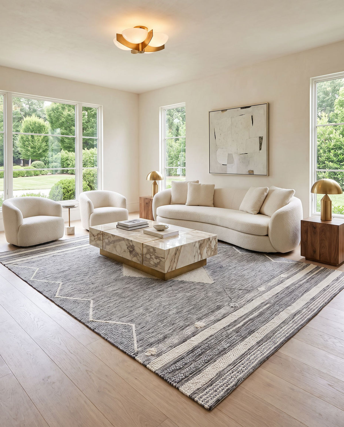 Azalea AZA-2317 Hand Woven Rug styled in an elegant designer living room — hand woven global area rug in light slate, medium gray, black and cream tones