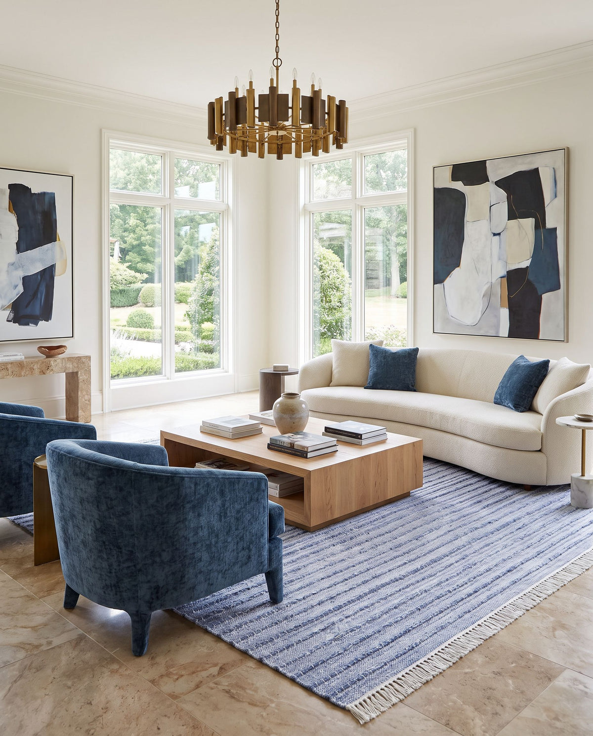 Azalea AZA-2337 Hand Woven Rug styled in an elegant designer living room — hand woven modern area rug in blue, ivory and cream tones