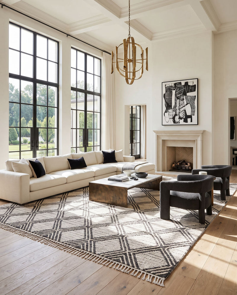 Bedouin BDO-2304 Hand Woven Rug as the centerpiece of a bright luxury living room — a hand woven global area rug in black and cream tones