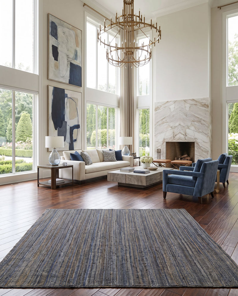 Brice BIC-7006 Hand Woven Rug as the centerpiece of a bright luxury living room — a hand woven cottage area rug in navy, blue and cream tones