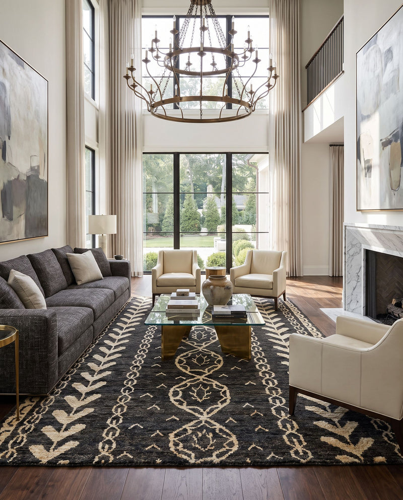 Bjorn BJR-1000 Hand Knotted Rug as the centerpiece of a bright luxury living room — a hand knotted global area rug in black, beige and brown tones