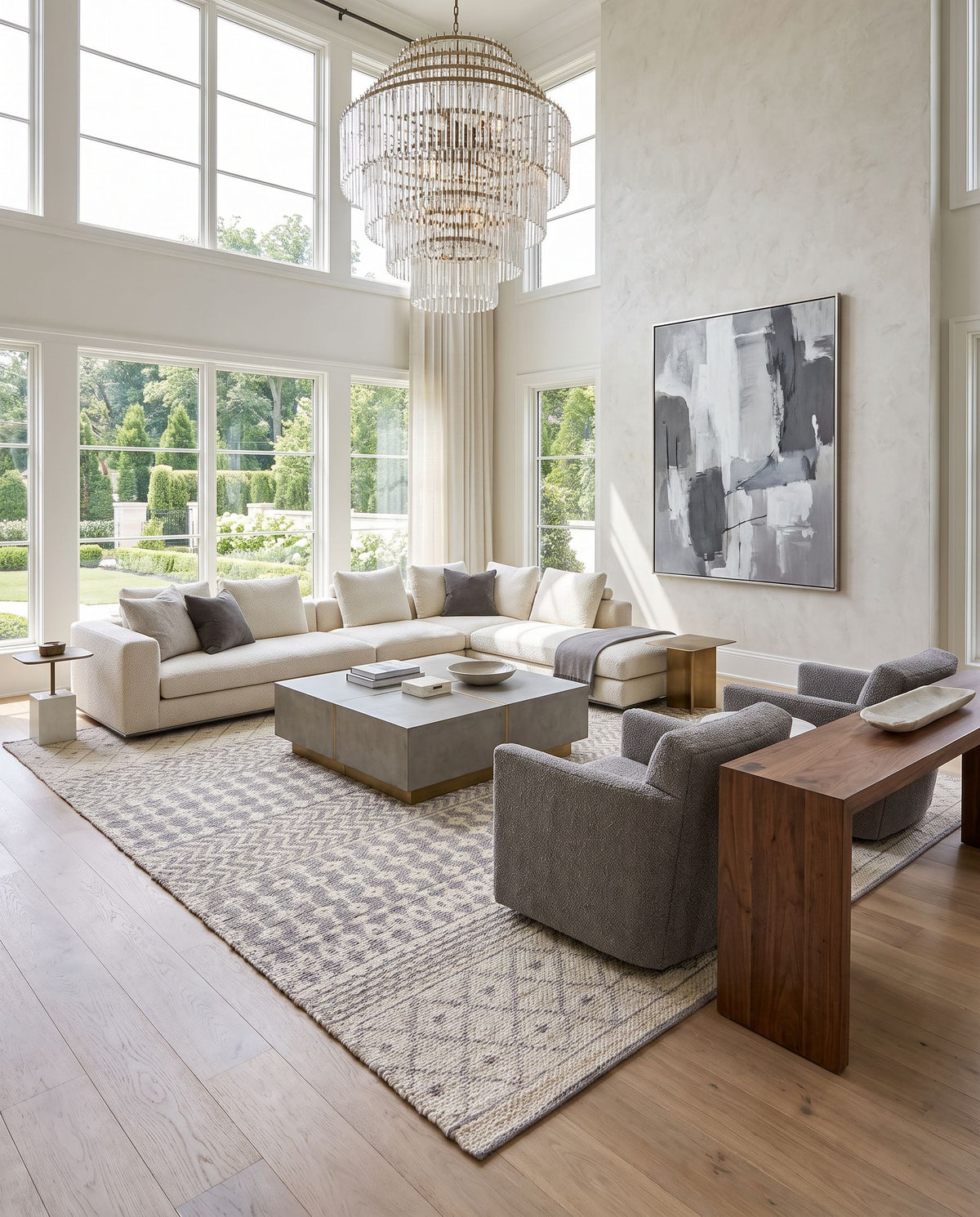 Bryant BRA-2401 Hand Woven Rug as the centerpiece of a bright luxury living room — a hand woven global area rug in light beige and medium gray tones