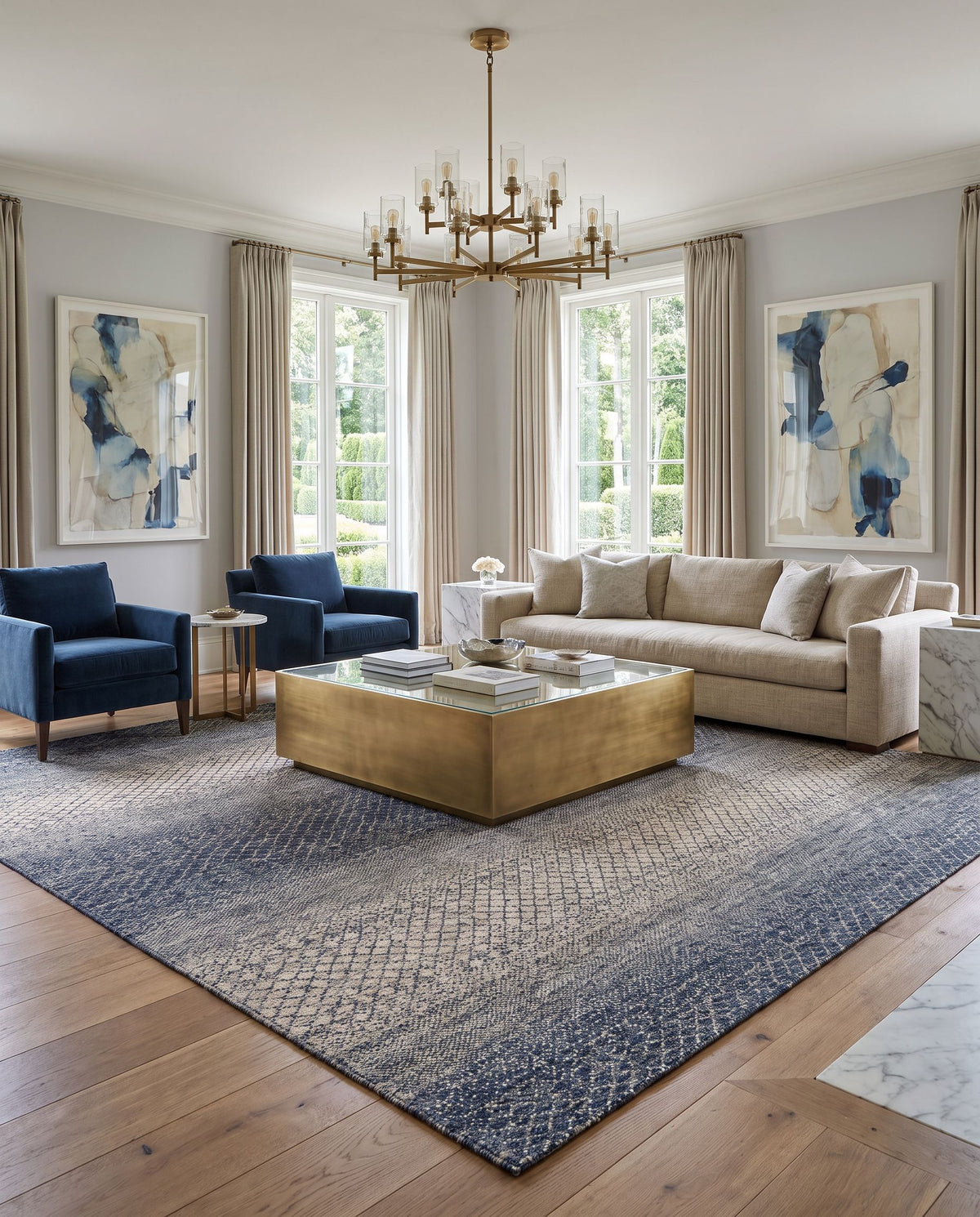 Bethesda BTD-2302 Hand Knotted Rug styled in an elegant designer living room — hand knotted global area rug in dark blue, denim, medium gray and light gray tones