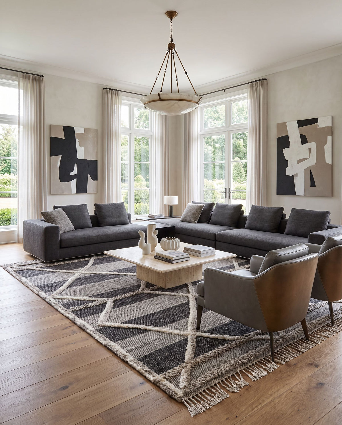 Cadiz CDZ-2304 Hand Knotted Rug styled in an elegant designer living room — hand knotted global area rug in gray, black and cream tones