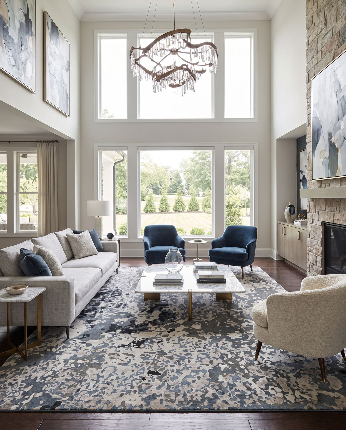 Chemistry CHM-2003 Hand Knotted Rug as the centerpiece of a bright luxury living room — a hand knotted modern area rug in navy, denim, off-white and dusty sage tones