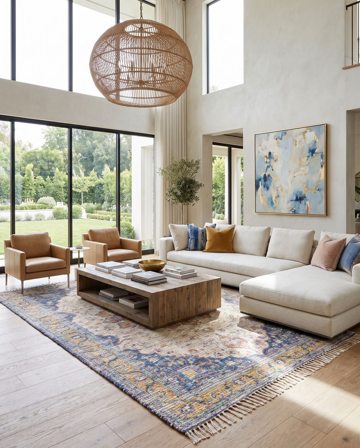 Coventry COV-2303 Hand Woven Rug as the centerpiece of a bright luxury living room — a hand woven traditional area rug in tan, orange, purple and light blue tones